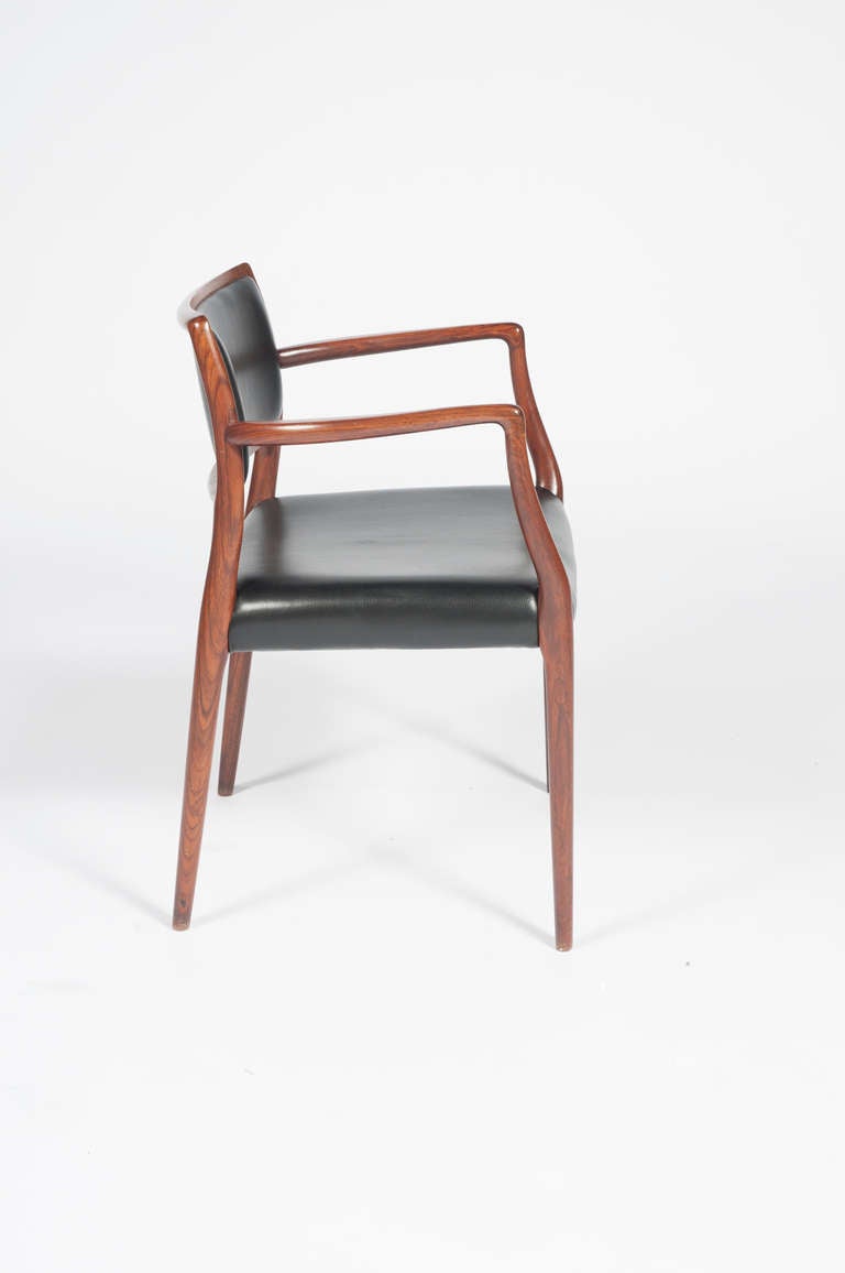 Elegant 1960s Moller armchair with graceful tapering lines. Would make a wonderful desk chair. New black leather upholstery. 

See this item in our Brooklyn showroom, 61 Greenpoint Ave., Suite 312, Brooklyn, 11 a.m. to 5 p.m. Tuesday through Friday