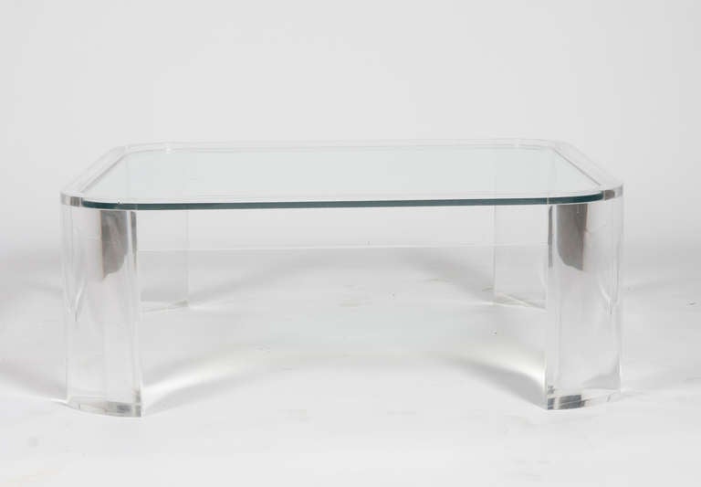 Absolutely stunning 1970s acrylic cocktail table with inset glass top by Les Prismatiques. The substantial cast-Lucite legs form the rounded corners of this square table. Gorgeous condition, signed 