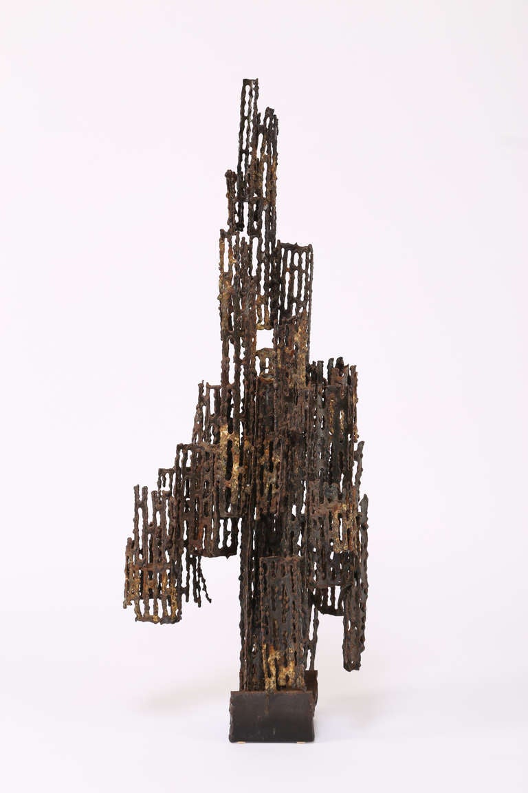 Ornate torch-cut steel sculpture mounted atop a section of I-beam by Marcello Fantoni. Impressed signature to the base. This item is at the 1stdibs Gallery at the New York Design Center, 200 Lexington Ave., 10th floor, New York, NY.