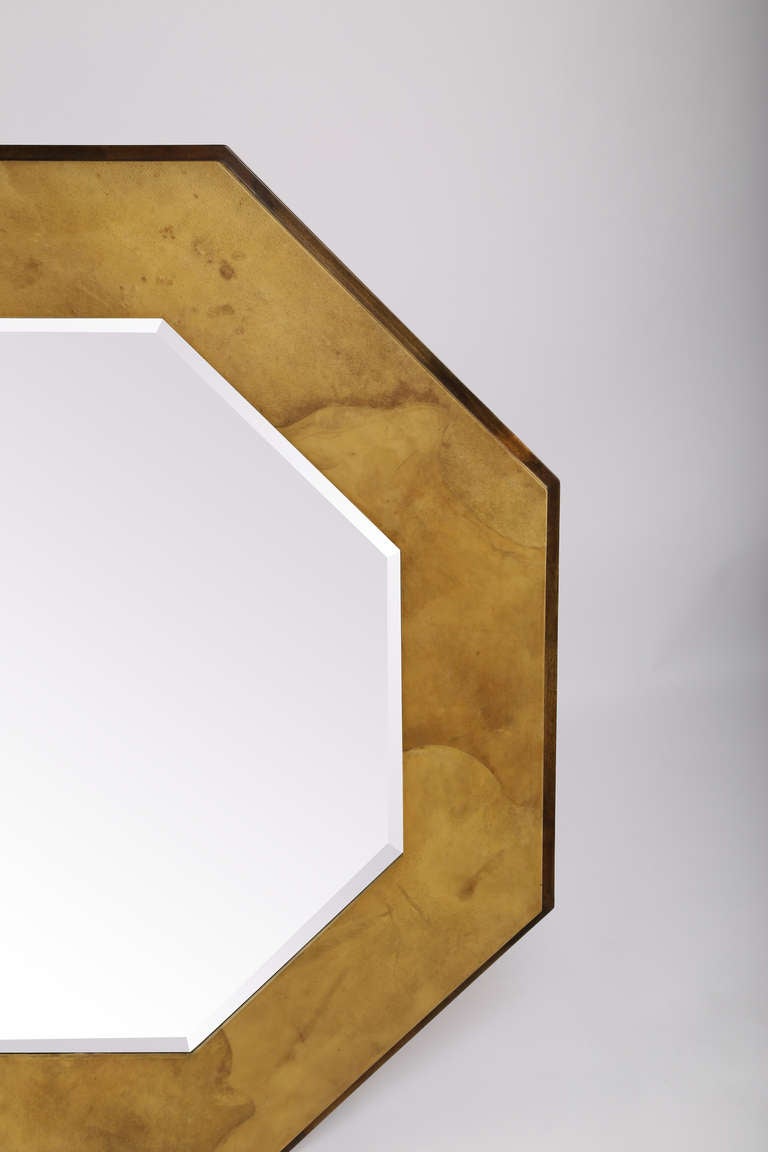 Stunning 1970s octagon-shaped mirror clad in a satin-finish lacquered faux goatskin in two tones of brown. See our matching Springer parchment console table. 

See this item in our Brooklyn showroom, 61 Greenpoint Ave., Suite 312, Brooklyn, 11 a.m.