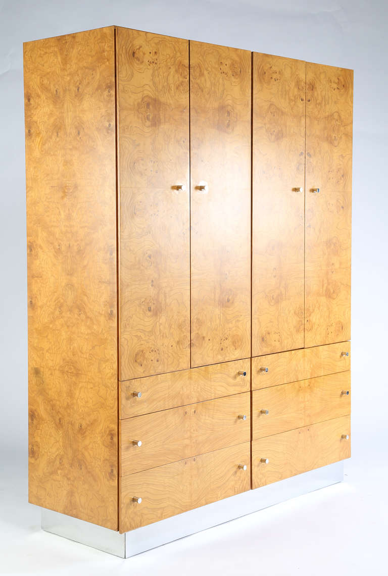 Stunning bookmatched burl veneer cabinet by Milo Baughman with six lower drawers and two upper cabinets over a recessed chrome base. This item is in our Brooklyn showroom.