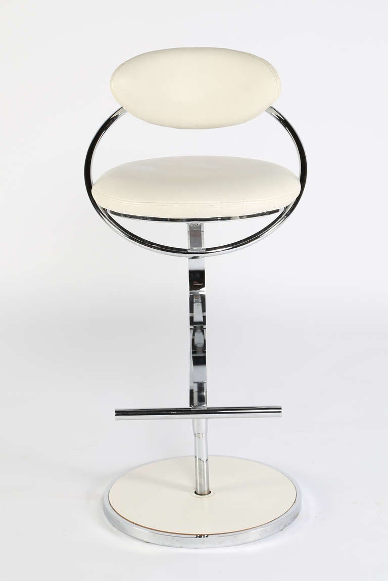 Curvaceous and cantilevered bar-height stools.  White vinyl seat and chromed steel frame in pristine condition.