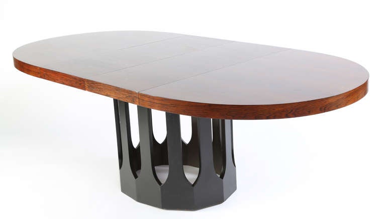 Rosewood racetrack top over 12 painted-black supports connected with Gothic-style arches. The table measures 42.5