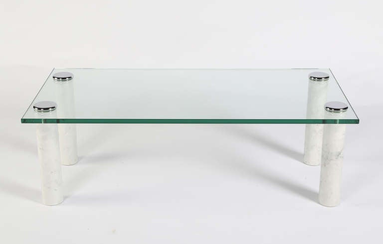 Chrome caps attach the thick rectangular glass top to the cylindrical white marble legs of this Pace Collection cocktail table. Legs could be used for tables of different sizes with a new piece of 3/4-inch glass. 

See this item in our Brooklyn