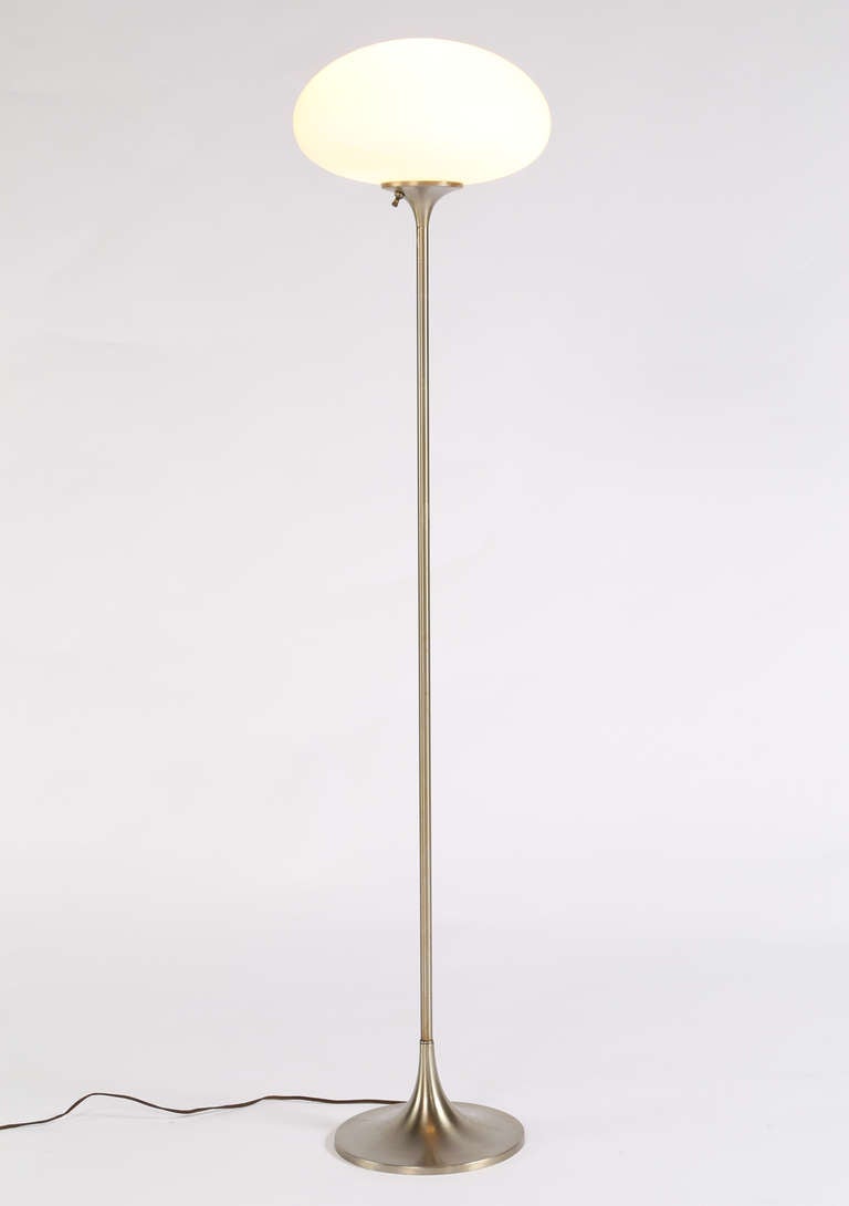 Classic 1960s Laurel floor lamp. Frosted glass mushroom shade resting on slender brushed nickel neck connecting to flared 10
