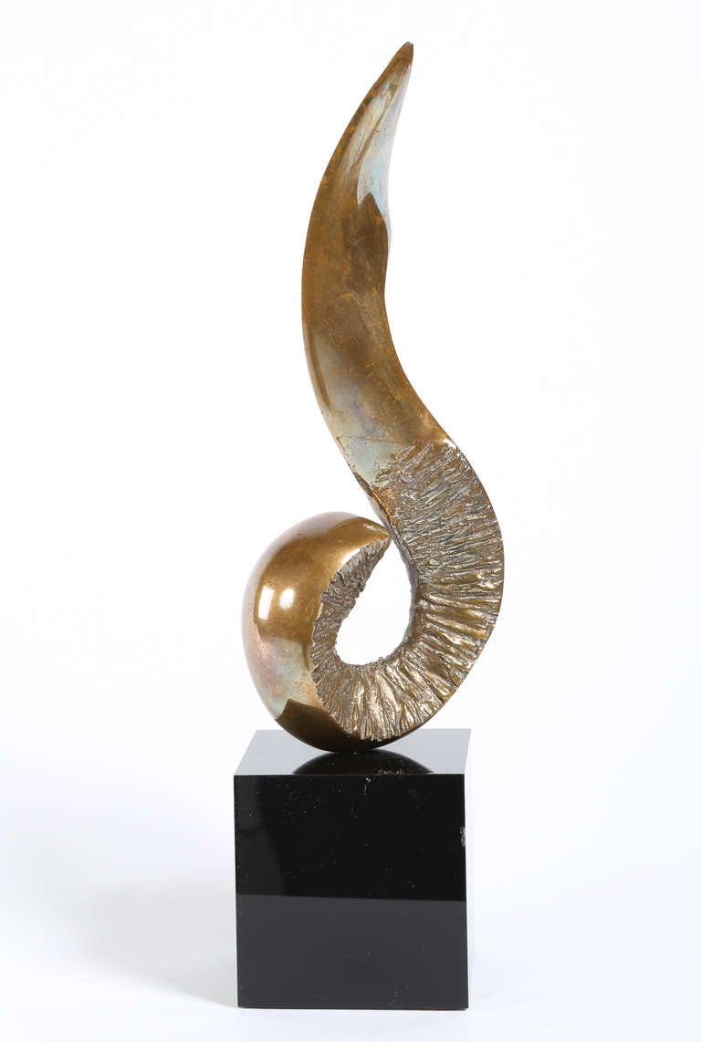 Biomorphic bronze form with contrasting smooth and rough textures. Mounted on a black acrylic base. Signed Joseph Burlini 3/5. Sculpture only, 3.75