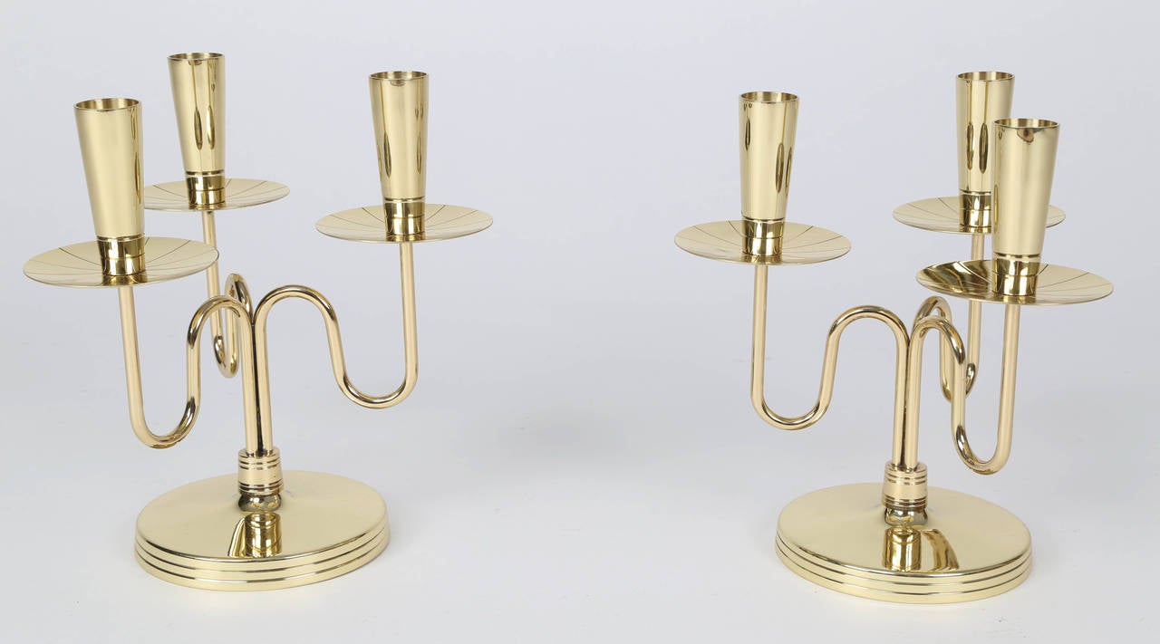 Elegant pair of three-arm 1950s, candelabra by Tommi Parzinger for Dorlyn Silversmiths. Stamped 