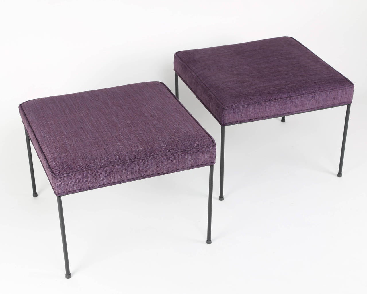 Paul McCobb benches with black wrought-iron frames and legs. Recently reupholstered in a lovely lavender woven fabric. These stools are in our Brooklyn showroom.