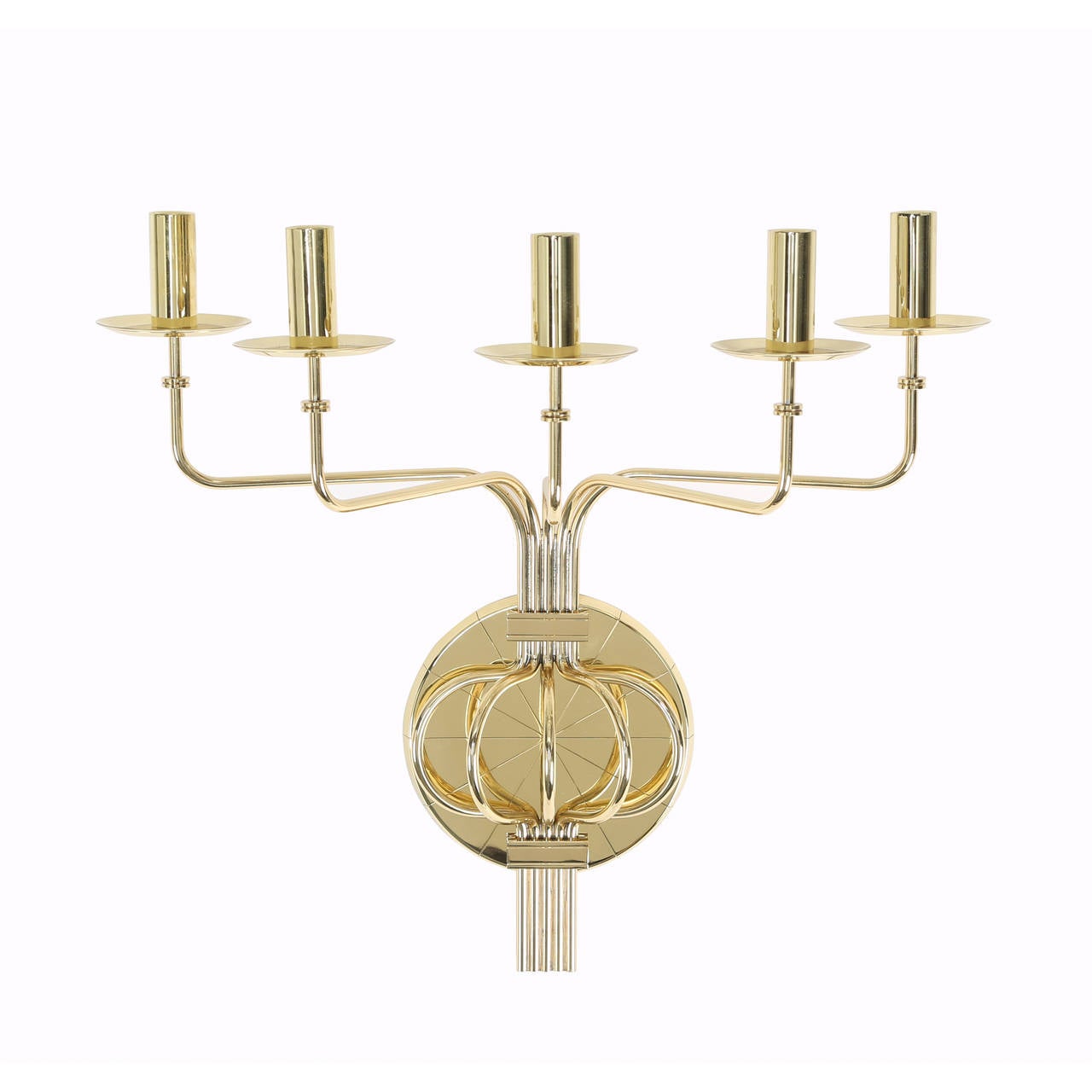 Large and dramatic solid-brass candle sconces with five splayed arms anchored in a disc engraved with Parzinger's signature radial pattern, circa 1950s. Newly polished and lacquered. 


