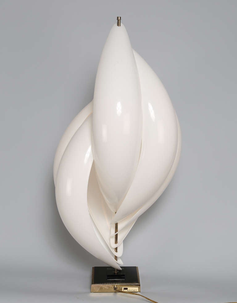 Large accent lamp consisting of seven overlapping white acrylic elements mounted on a center pole. Rougier label on base. Base is 6.25 inches square. 

