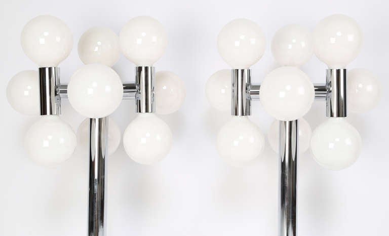 Striking 1970s table lamps each feature nine sockets with large bulbs. Rewired with new built-in dimmers. Excellent condition with Sonneman labels. Measures: 33.25