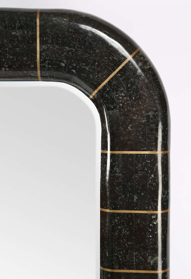 1970s mirror clad in tessellated marble with brass inlays, in the style of Karl Springer. Beveled mirror. Gorgeous and heavy.