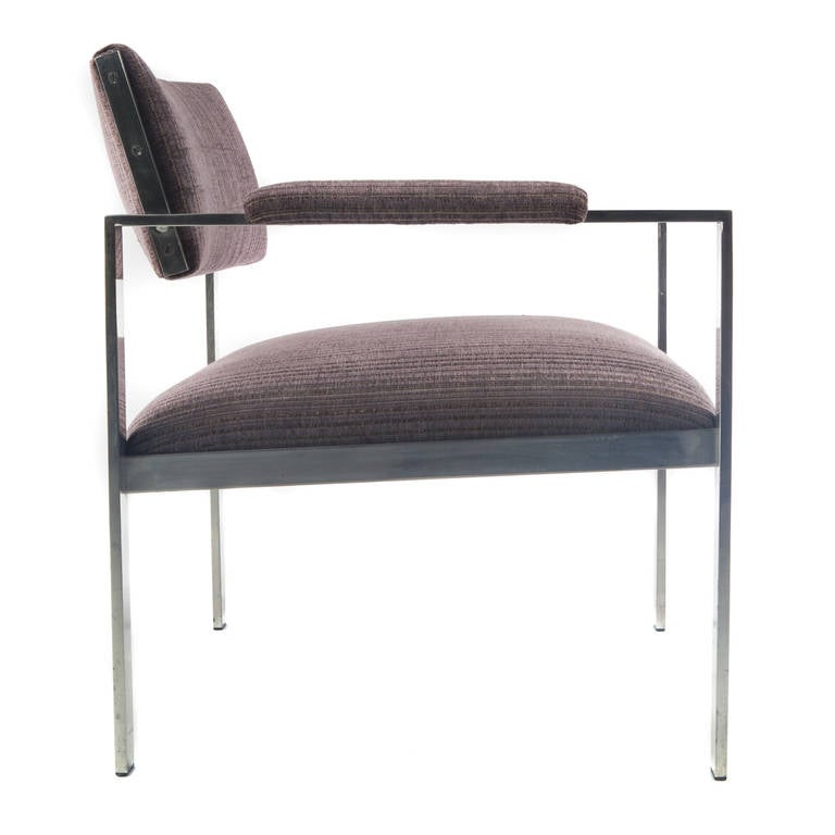 Nicely scaled armchair in polished flat-bar aluminum. Open back gives it a weightless look. Sturdy, versatile and comfortable. Newly reupholstered in a striped lavender velvet. 

