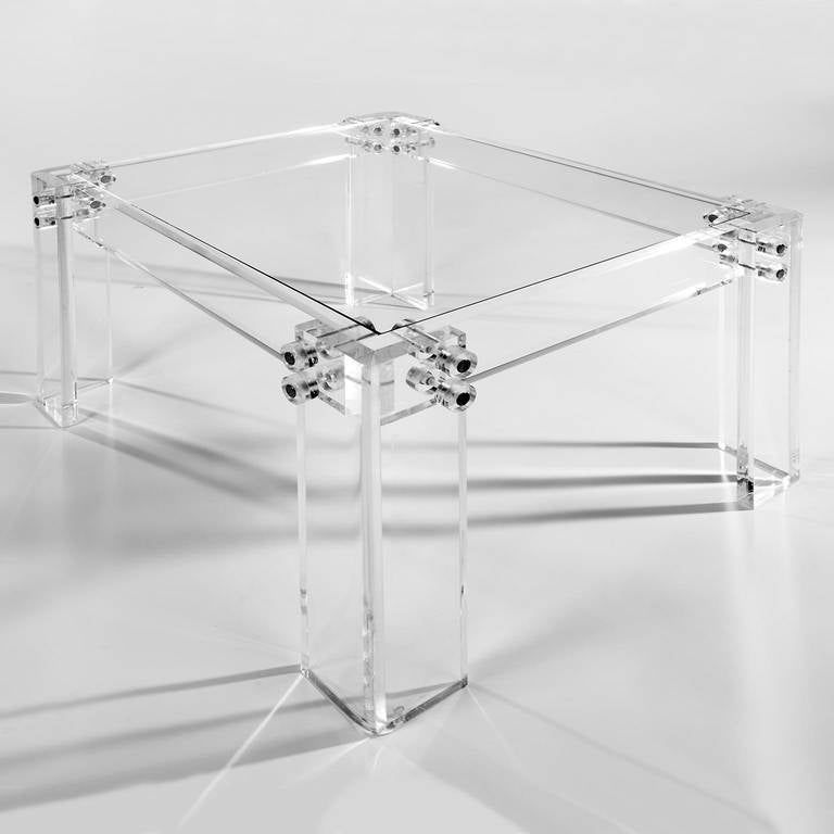 Thick squared Lucite legs connected by chrome bolts with Lucite lugs. Inset glass top. Industrial glam all the way. 

See this item in our Brooklyn showroom, 61 Greenpoint Ave., Suite 312, Brooklyn, 11 a.m. to 5 p.m. Tuesday through Friday and by