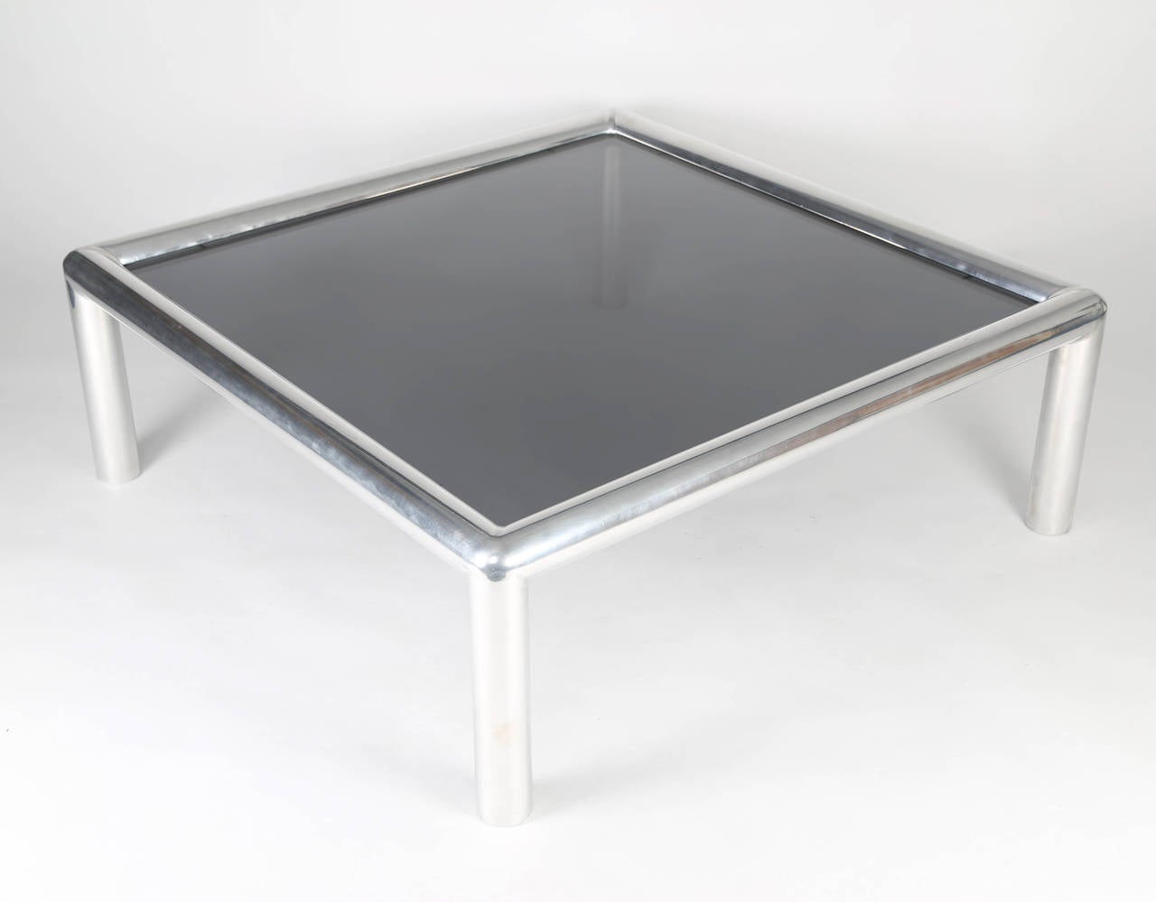 Large, square tubular-aluminum and smoked-glass coffee table from the 