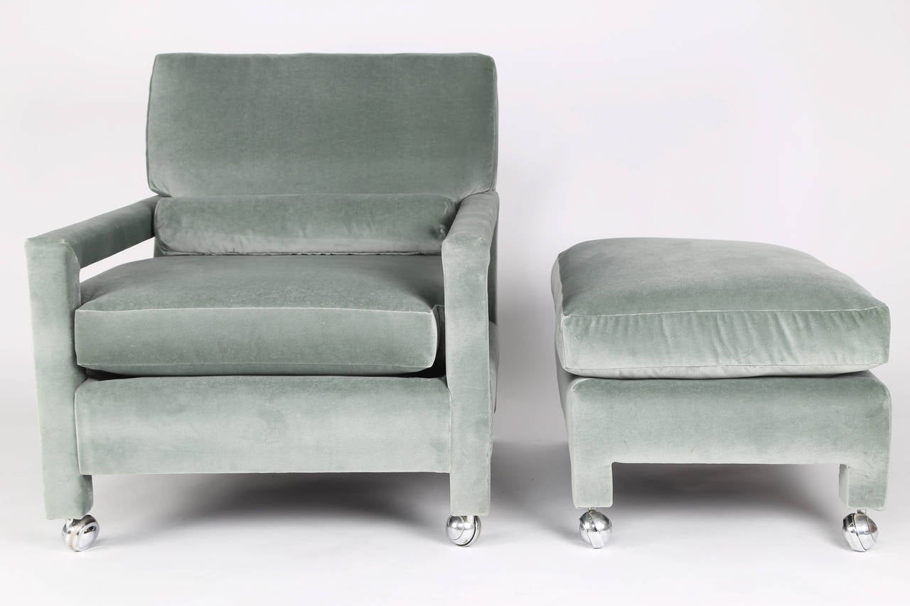 Large and comfortable fully upholstered reclining lounge chair and ottoman on chrome casters. Newly reupholstered in 100-percent cotton, light-green velvet with new foam cushions. Milo Baughman for Thayer Coggin. Fabric swatch available. Chair 30