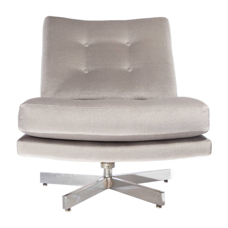 Chic low-slung Baughman for Thayer-Coggin swivel chair with five-spoke chrome base, newly reupholstered in gray mohair. The swivel works well and the chair has a slight give. Chic, flexible and comfortable. 

