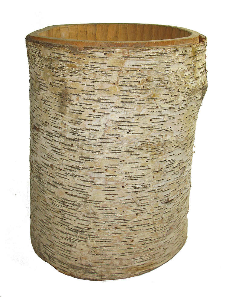 This birch log was hand shaped into a hollow cylinder and then fitted with a finely worked bottom piece that was scribed to match the grooves on the interior that were left from the process of hollowing. It is a unique and useful entryway accessory
