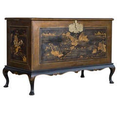 A black and gilt Japanned Coffer On Stand, Circa 1730.