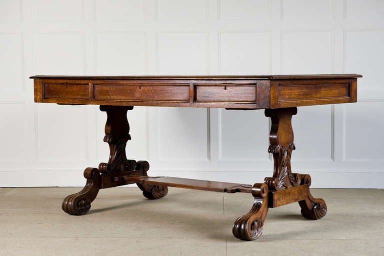 British Oak Standard End Writing Table circa 1840 with Foliate Carving to the Ends and Feet and with Original Rexine Top For Sale