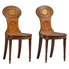A pair of oak hall chairs circa 1800