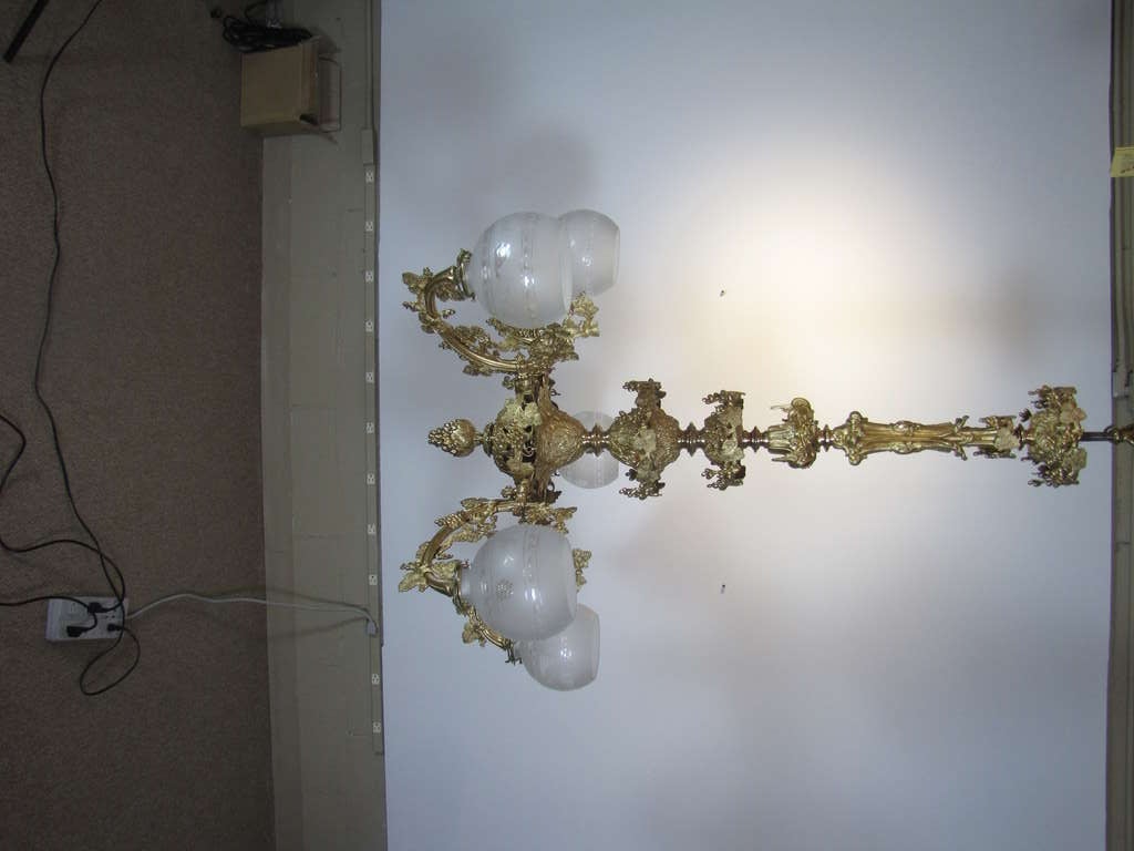 This is a rococo revival chandelier with grape vine details.  Originally gas, and made by Henry Hooper & Co. of Boston. 

Originally from the Jamaica Plain summer estate of Dr. John Collins Warren, the first surgeon to use ether for anaesthesia in