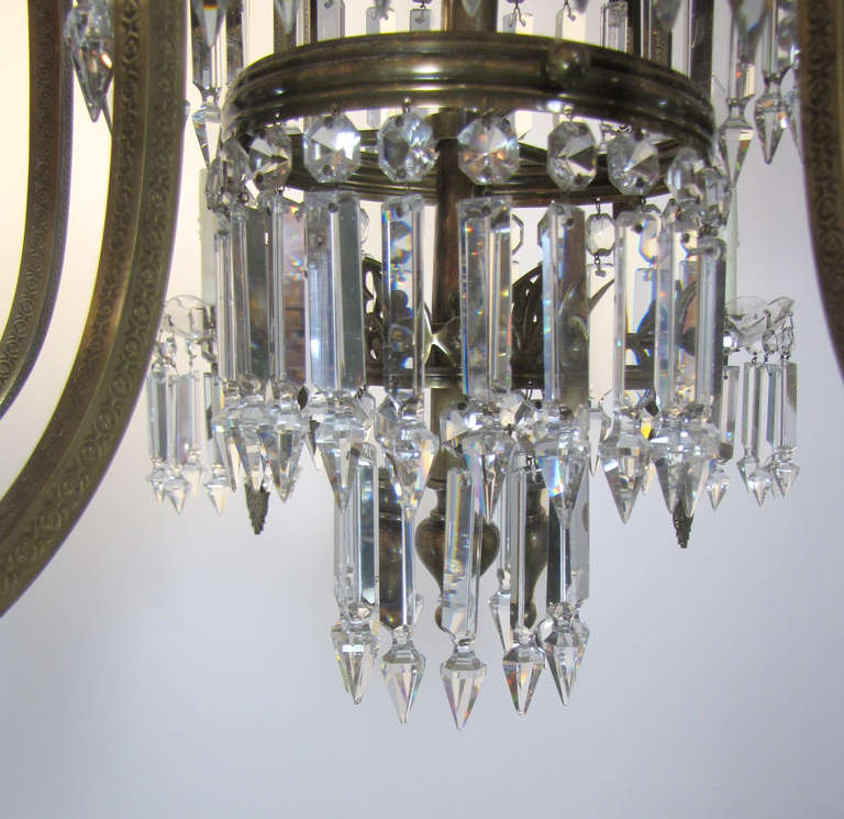 Pair of Regency Six-Arm Brass and Crystal Chandeliers In Excellent Condition For Sale In Chestnut Hill, MA