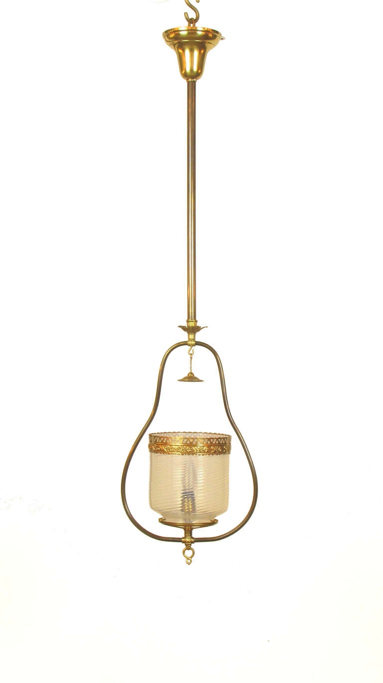 A harp fixture or lantern with the original swirled opal glass and smoke bell.   This piece was originally lit with a gas burner, and has been electrified for a single standard bulb.  The height is 48
