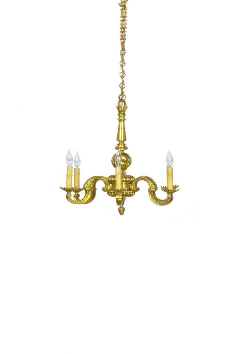This is a simple yet elegant french bronze chandelier with six arms and a gold toned finish. The height of the chandelier only is listed below at 21