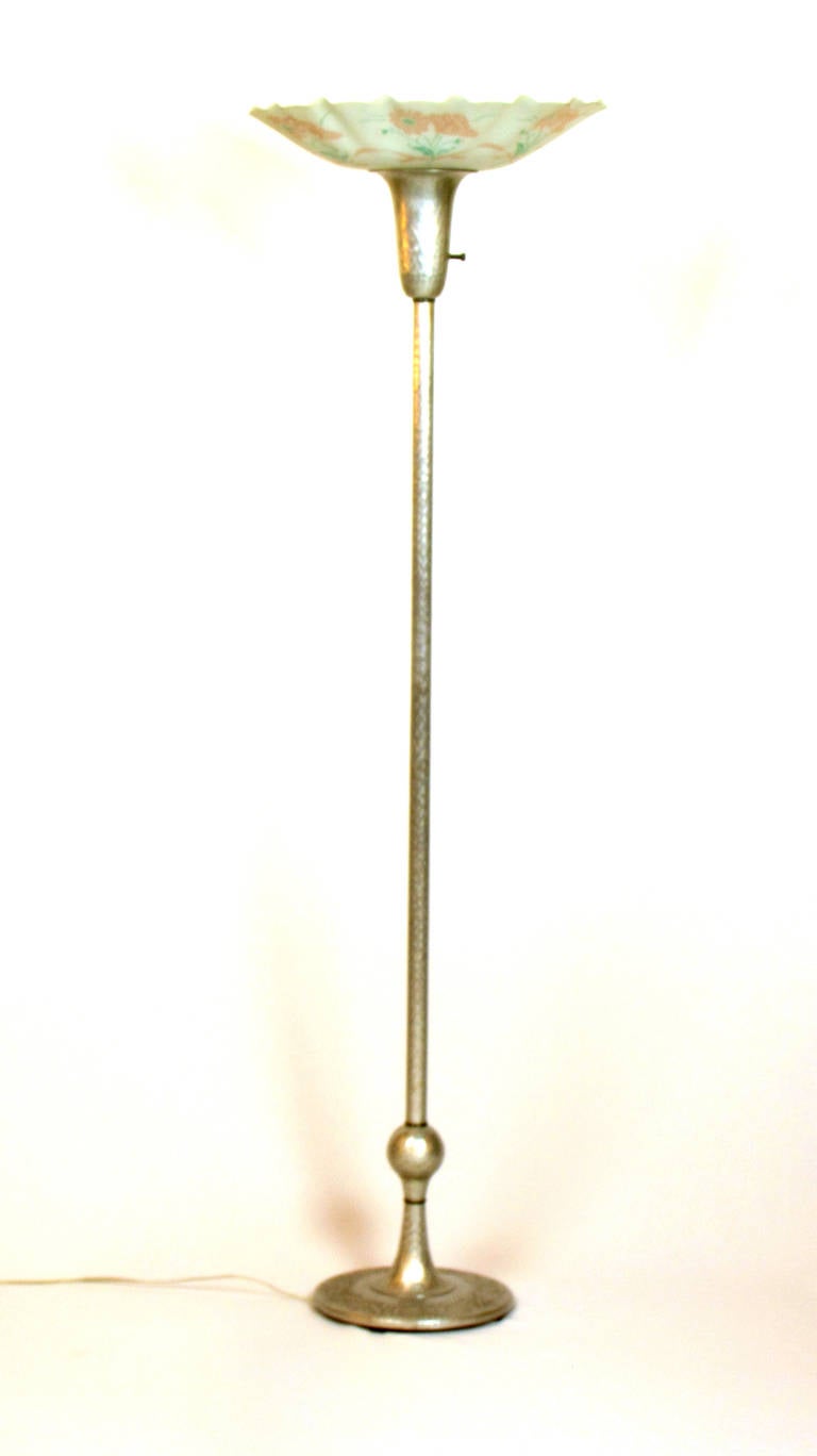 Hammered Aluminum was popular in the 1930s through 1950s, and widely found in small gift items such as ice buckets and serving trays. This is the only floor lamp of its kind we have ever come across. The base has lovely details of roses and poppies