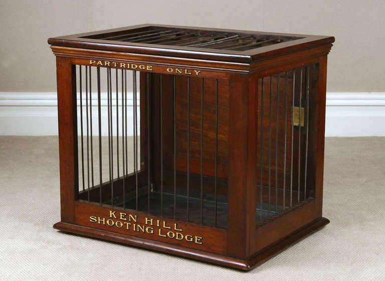 MAHOGANY PARTRIDGE CAGE from Ken Hill House, Norfolk, English, late 18th century.

With removable internal metal base and metal bars to three sides and top, the back with a panelled mahogany door, inscribed in shaded gold ‘ALL KEYS TO BE LEFT / AT