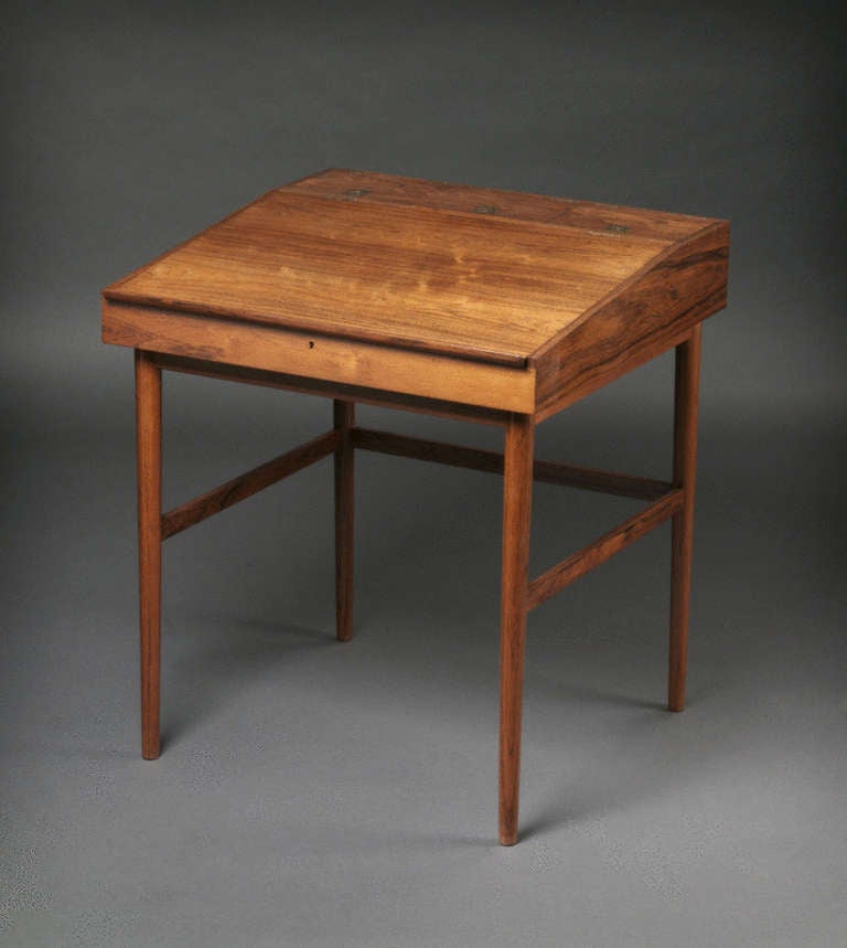 Finn Juhl (1912-1989) Rosewood Desk
Designed 1942, Cabinet-maker Niels Vodder. 

Literature: Finn Juhl is one of the most celebrated architects and designers of the 20th Century, and one of the most distinctive designers of the Danish Modern