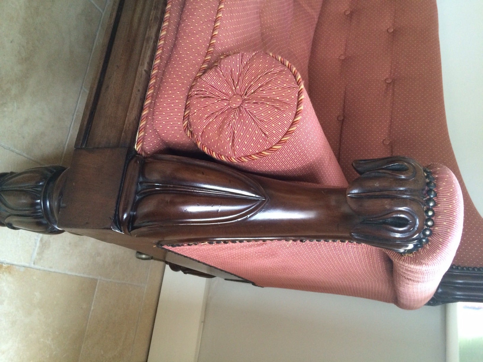 A Good quality carved mahogany chaise longue . Precisely carved with stylised leaf motif to the armrest and bold feet. Well defined moulding to the front frieze . The curved and  carved  piece to the base of the chaise longue with  two original 
