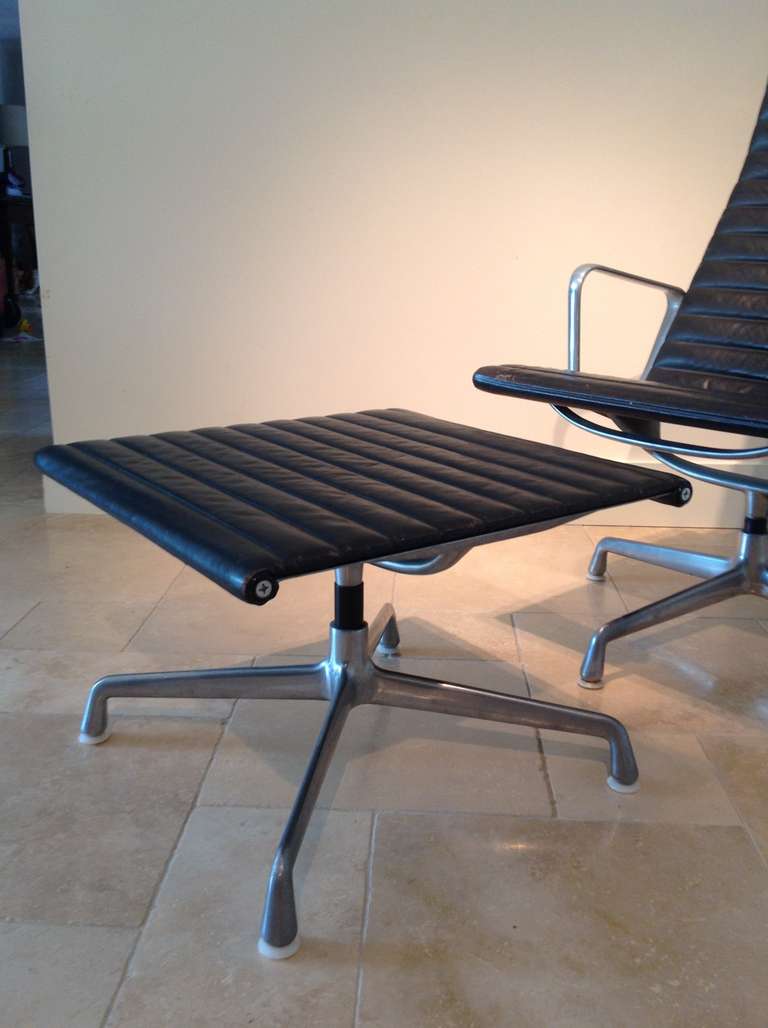 Modern An Eames Herman Miller aluminium and leather  EA124 lounge chair and ottoman