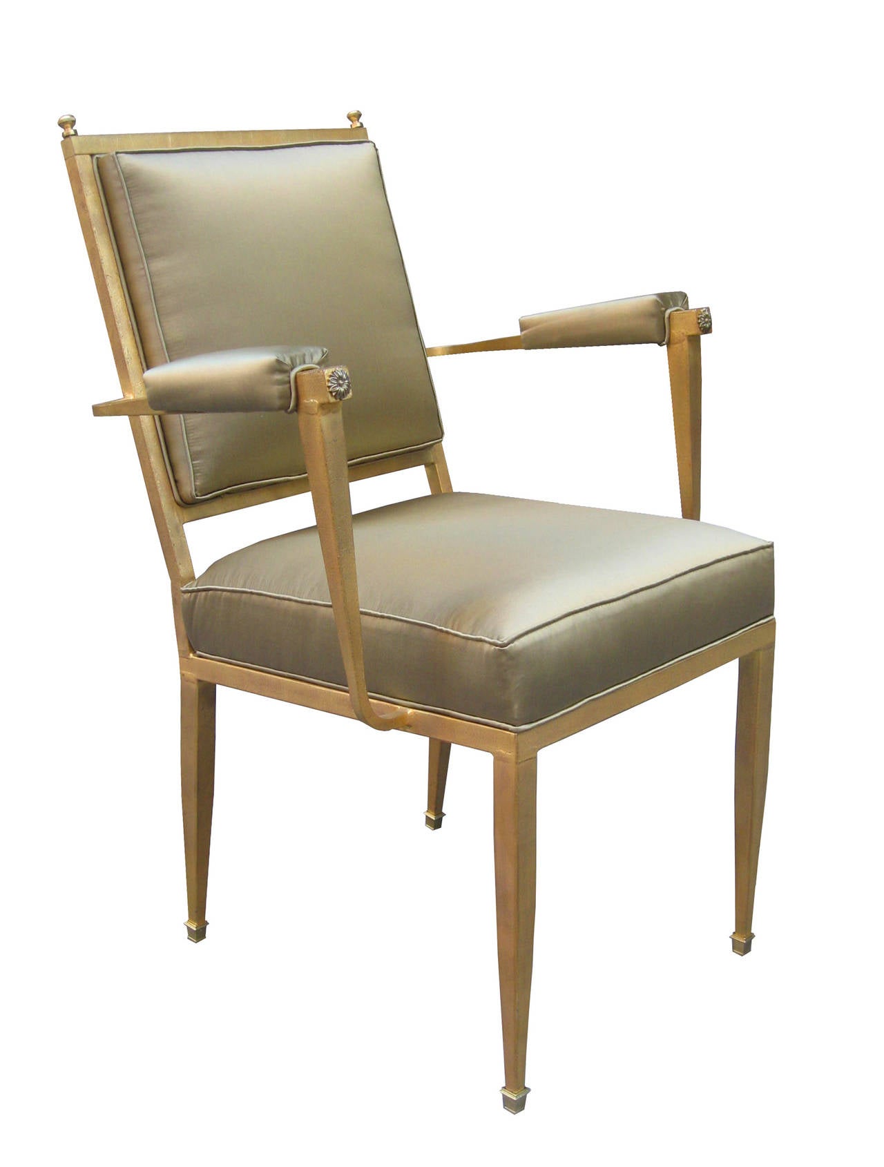 A fine pair of Art Deco armchairs.
Gold leaf craquelure-finished metal
with patinated bronze details and sabots.