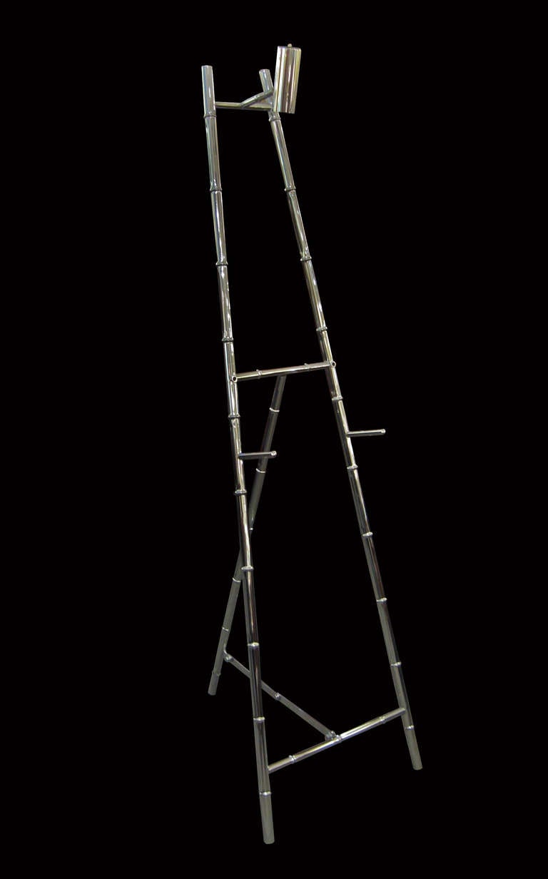 A modernist stylized bamboo easel with overhead light.
Nickeled brass. Re-wired for America.