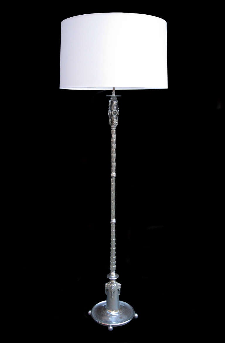 An Oscar Bach designed Art Deco floor lamp with peacock feather motif.
Featuring metal tag with Oscar Bach signature. 
Shade diameter: 24 inches.