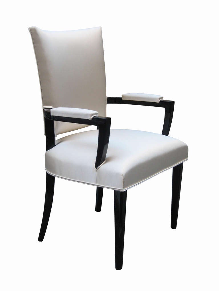 A pair of modernist ebonized armchairs.