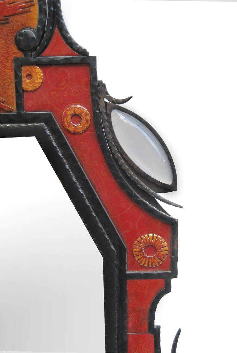 Rare and unusual mirror designed by André Dubreuil.
Wrought iron with four cabochon mountain crystals 
and enameled insets in red, burnt orange and gold.
Limited edition.
André Dubreuil (French, 1951 -) is a leading figure 
in the