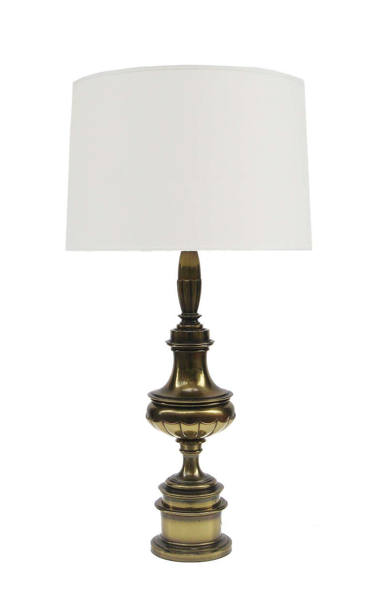 A pair of Classic Modern table lamps 
Central urn shaped form on a stepped round base.