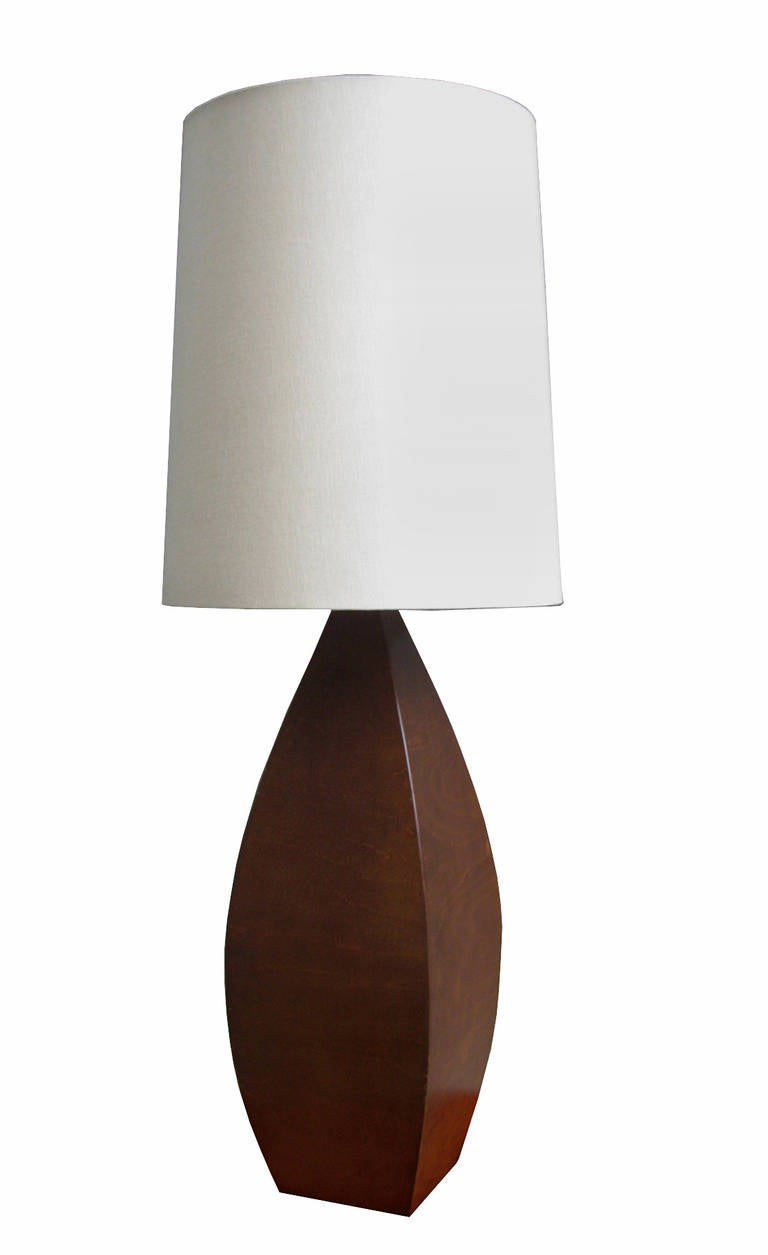 An Italian Modernist table lamp with a tapered wood form.