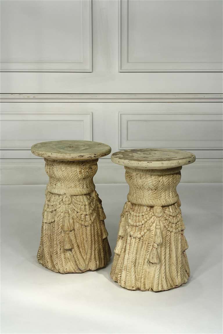 Pair of vintage cast tassel side tables. Can also be used as stools.