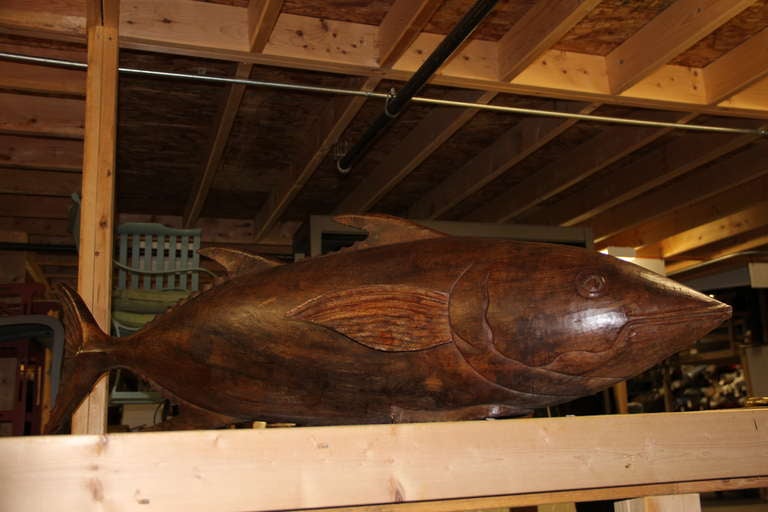 Large hand-carved teak tuna fish. Would be a fabulous centerpiece on a large dining table or sideboard.