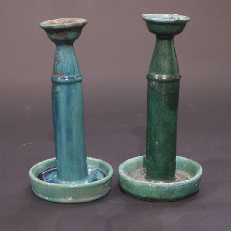 A pair of vintage porcelain candlesticks of Chinese origin.