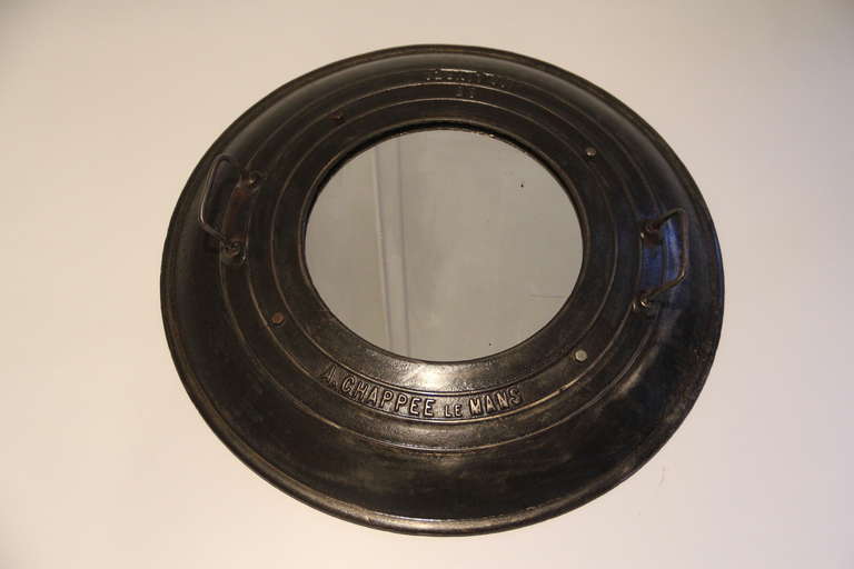 Round steel mirrors made from French man-hole covers. Stamped A. Chappee le Mans France. Newly added mirror. Two available.