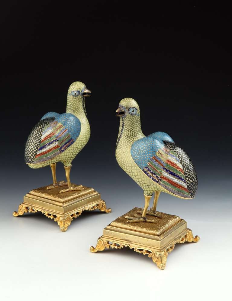 A fine pair of late 18th century Chinese export cloisonné incense burners in the shape of quails in bright colours mounted on 19th century ormolu bases terminating in scroll feet. 

The quails:
Chinese export, Qianlong period, circa 1770

The