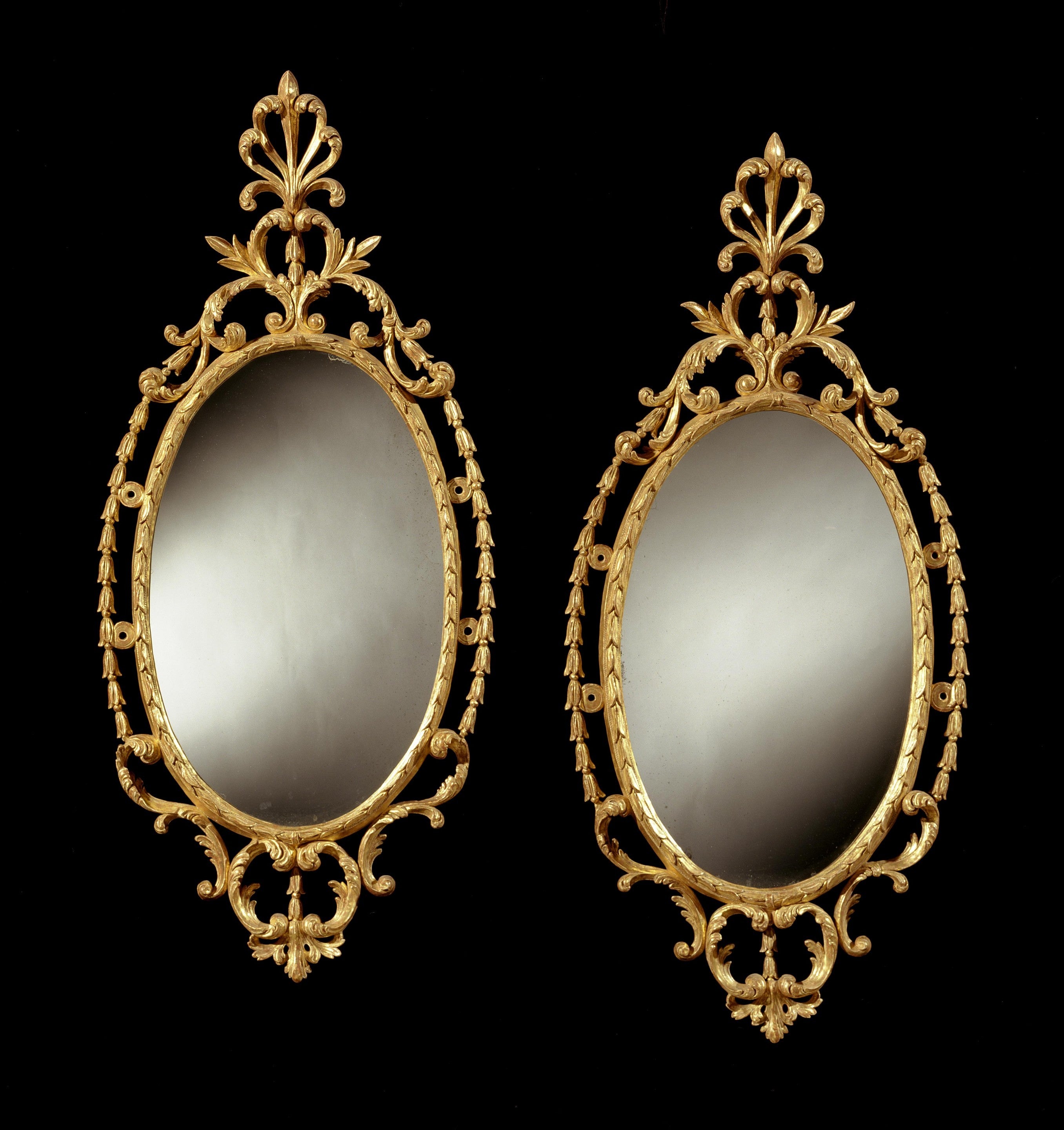 A Pair of George III Oval Border Glass Mirrors (449500) For Sale