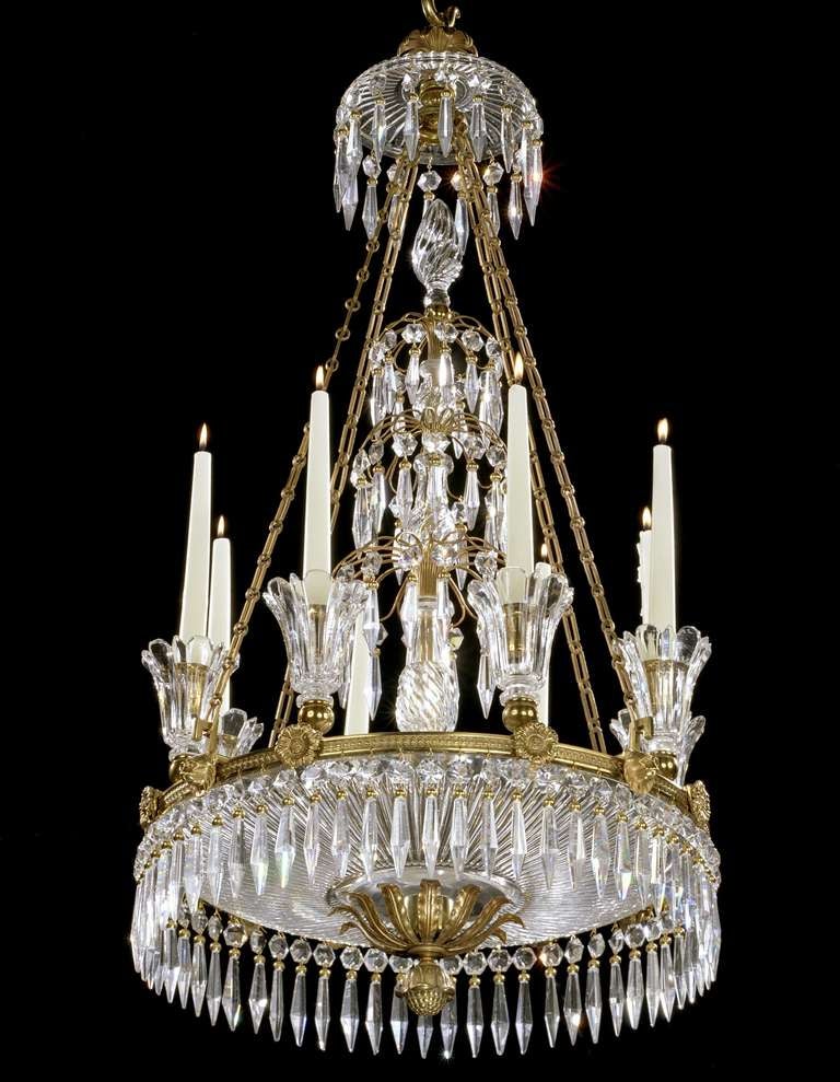 A fine quality early 19th century ormolu and cut glass dish light hung overall with faceted drops, the canopy above a large circular cut glass dish with a central rising triple-tiered cascade surmounted by a glass finial, the ormolu-bound dish