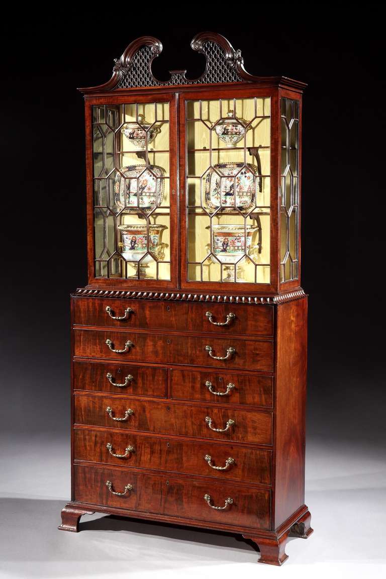 An extremely rare and exceptionally fine mid 18th century Chippendale period carved mahogany secrétaire display cabinet in the manner of William Vile, having a moulded scroll pediment with acanthus carving and fine trellis centre with platform,