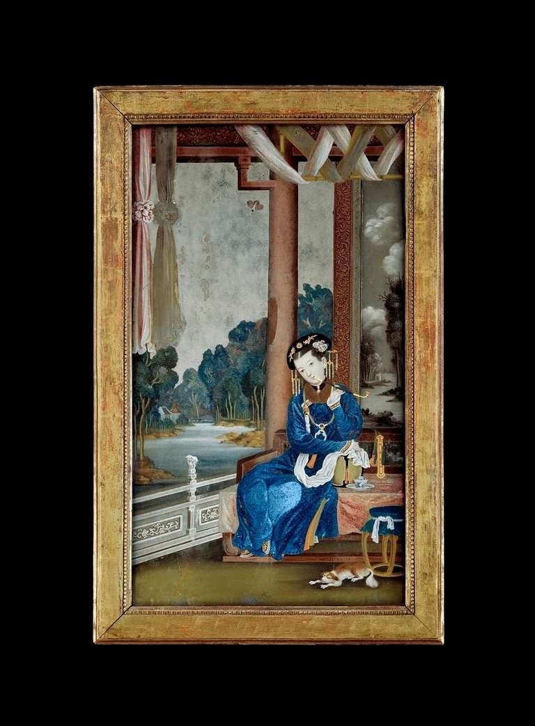 A fine mid 18th century Chinese export reverse mirror painting. The upright rectangular bevelled plate within the original pearl moulded giltwood frame depicting a Chinese courtly lady smoking a pipe on an opium bed, with a dog in the foreground,